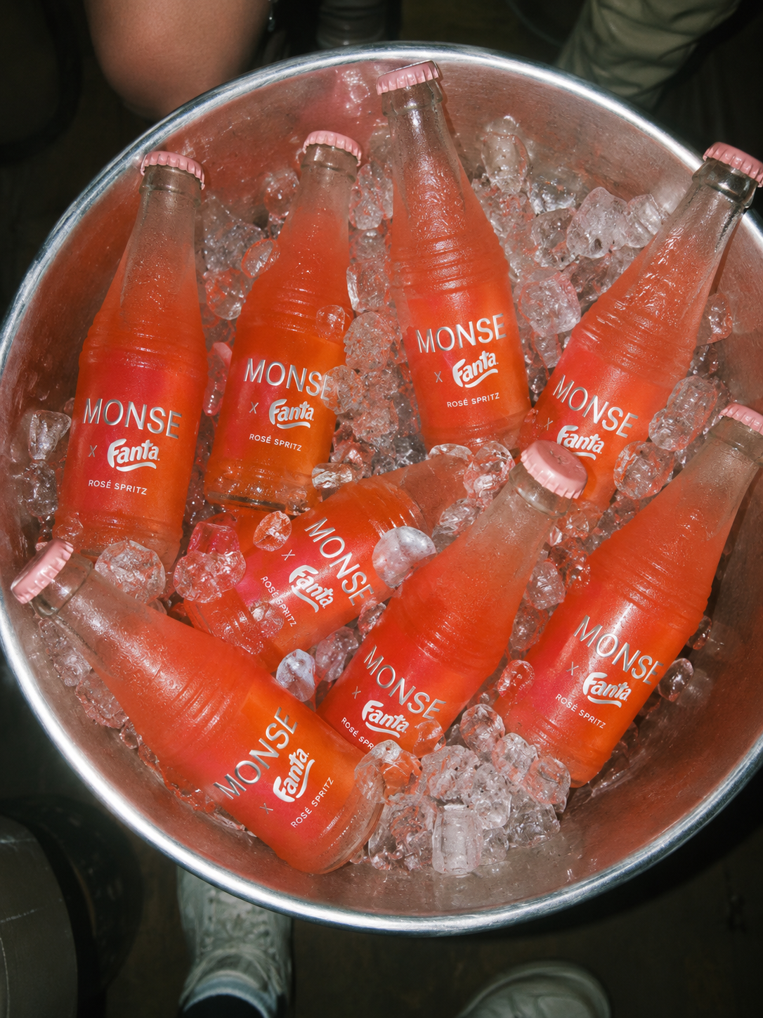 An ice bucket of MONSE × Fanta Rosé Spritz bottles